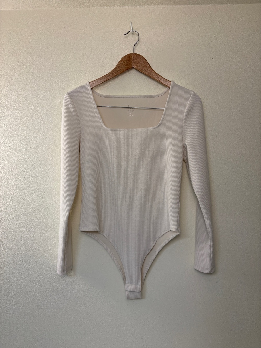 a new day long sleeve bodysuit cream casual quiet luxury layers feminine cozy